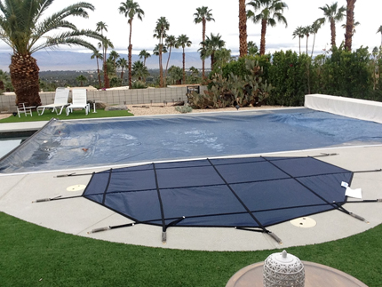 Spa cover next to automatic pool cover in Escondido. 