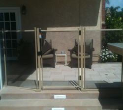Sand and brown 4 foot mesh self closing gate in Chula Vista