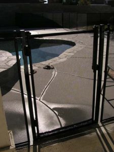 Black mesh pool gate installed in Chula Vista